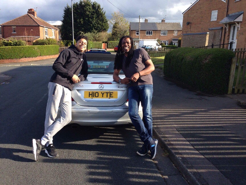 Lorenzo Hoyte (R) and his son. Mr Hoyte has lived in the UK since 1965