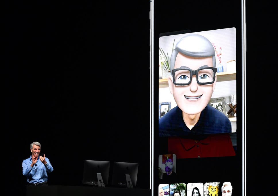 Apple CEO Tim Cook (L) speaks using his Memoji during a group FaceTime call on stage during Apple's Worldwide Developer Conference (WWDC) at the San Jose Convention Centerin San Jose, California