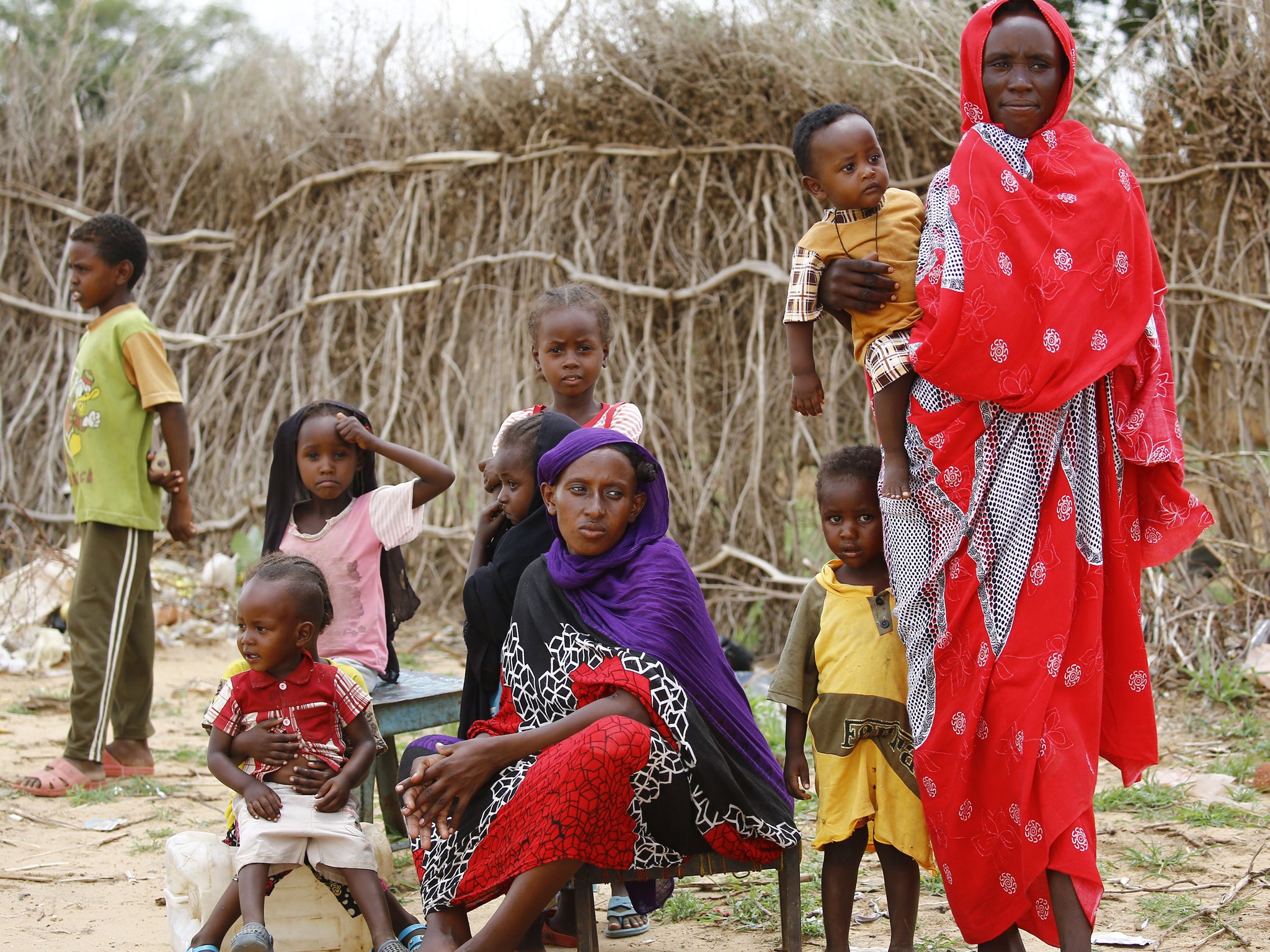 South Sudanese refugees sit at the Al-Nimir camp in the Sudanese state of East Darfur