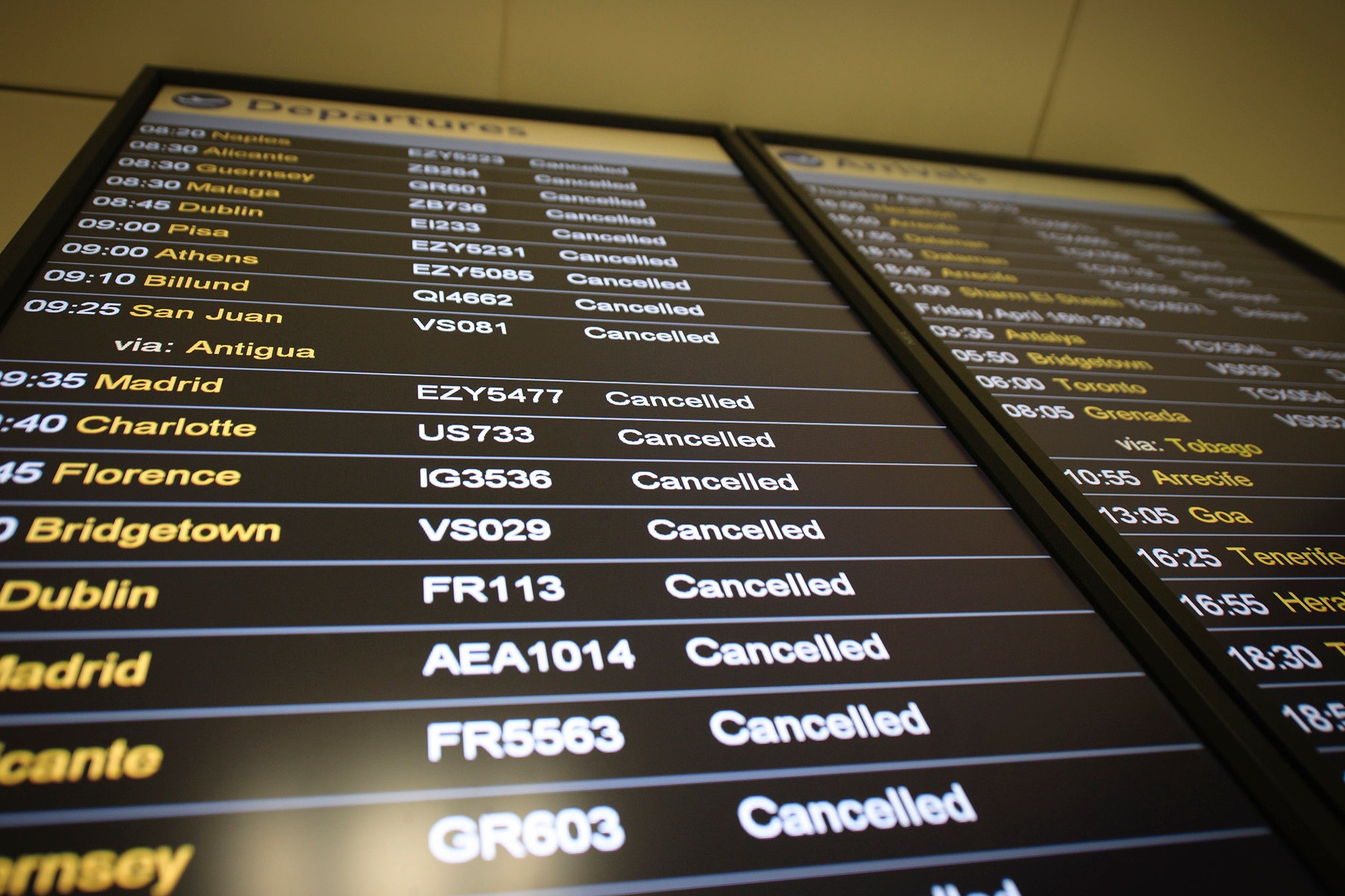 A departure board displays a cancelled flights at London Gatwick