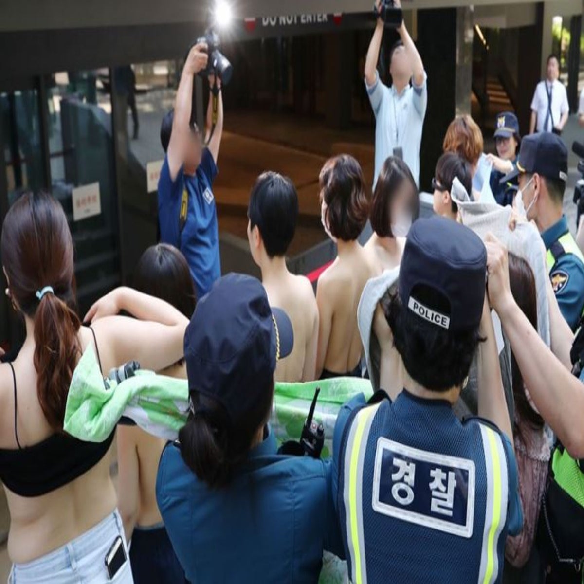 Women stage topless protest over Facebook 'discrimination' in South Korea |  The Independent | The Independent