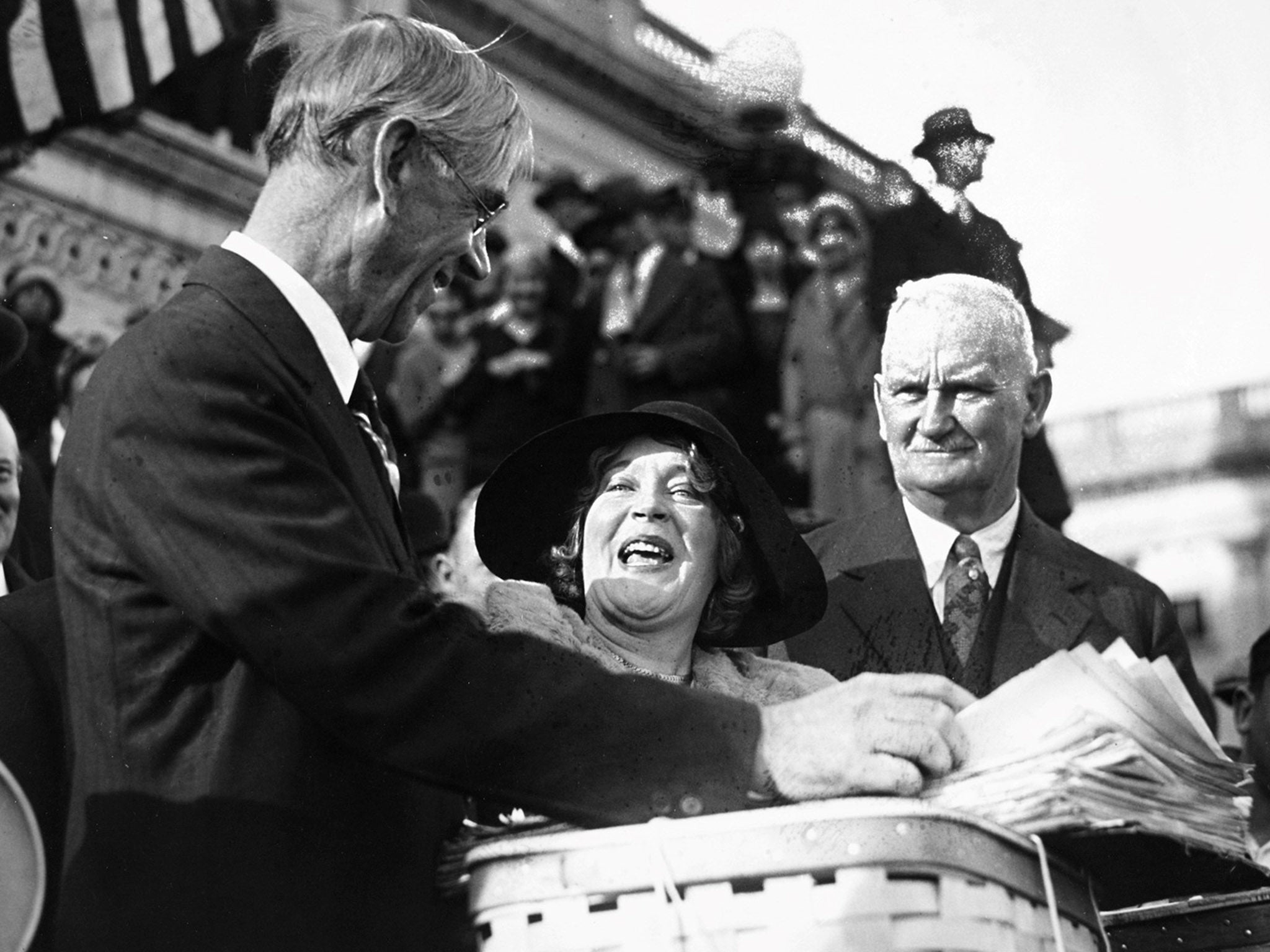 Reed Smoot (left) and Willis Hawley on the steps of the Capitol Building with petitions for reductions in their proposed tariff bill, December 1929