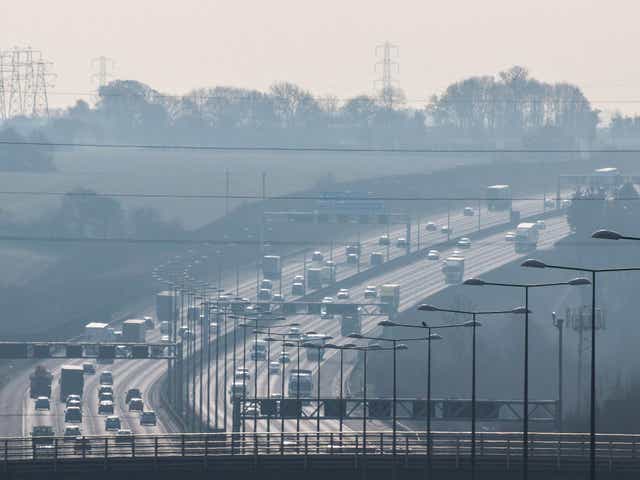 British motorway in a rush hours, in a foggy afternoon