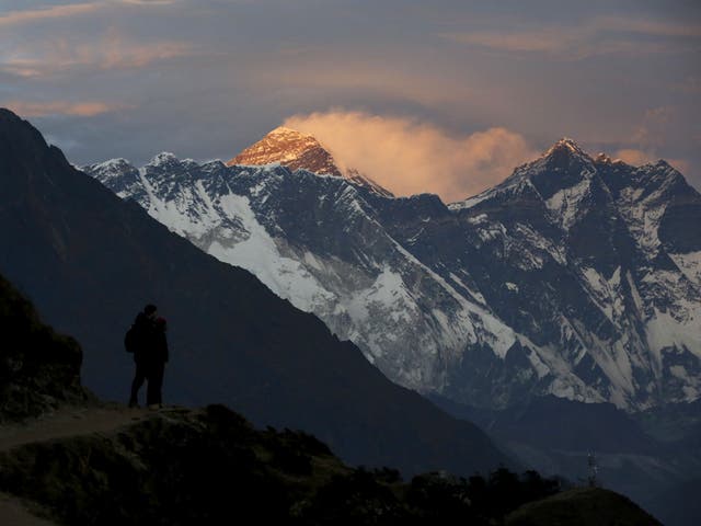 Light illuminates Mount Everest during sunset