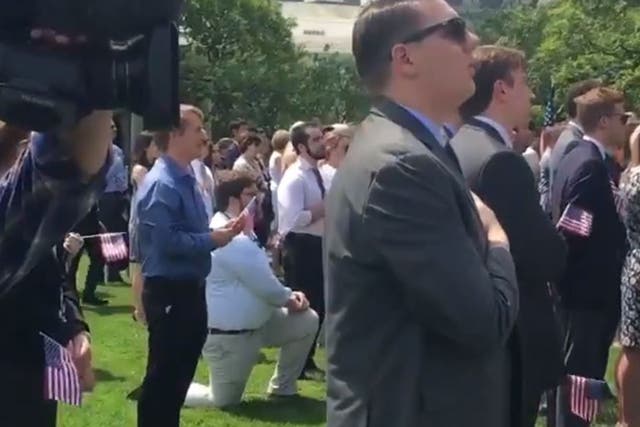 Man kneels during national anthem at the White House