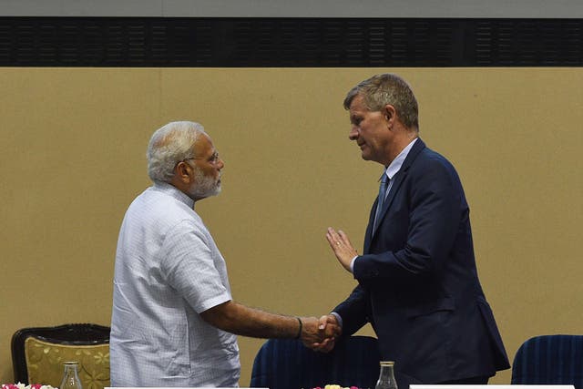 India's prime minister Narendra Modi shakes hands with United Nations environment chief Erik Solheim