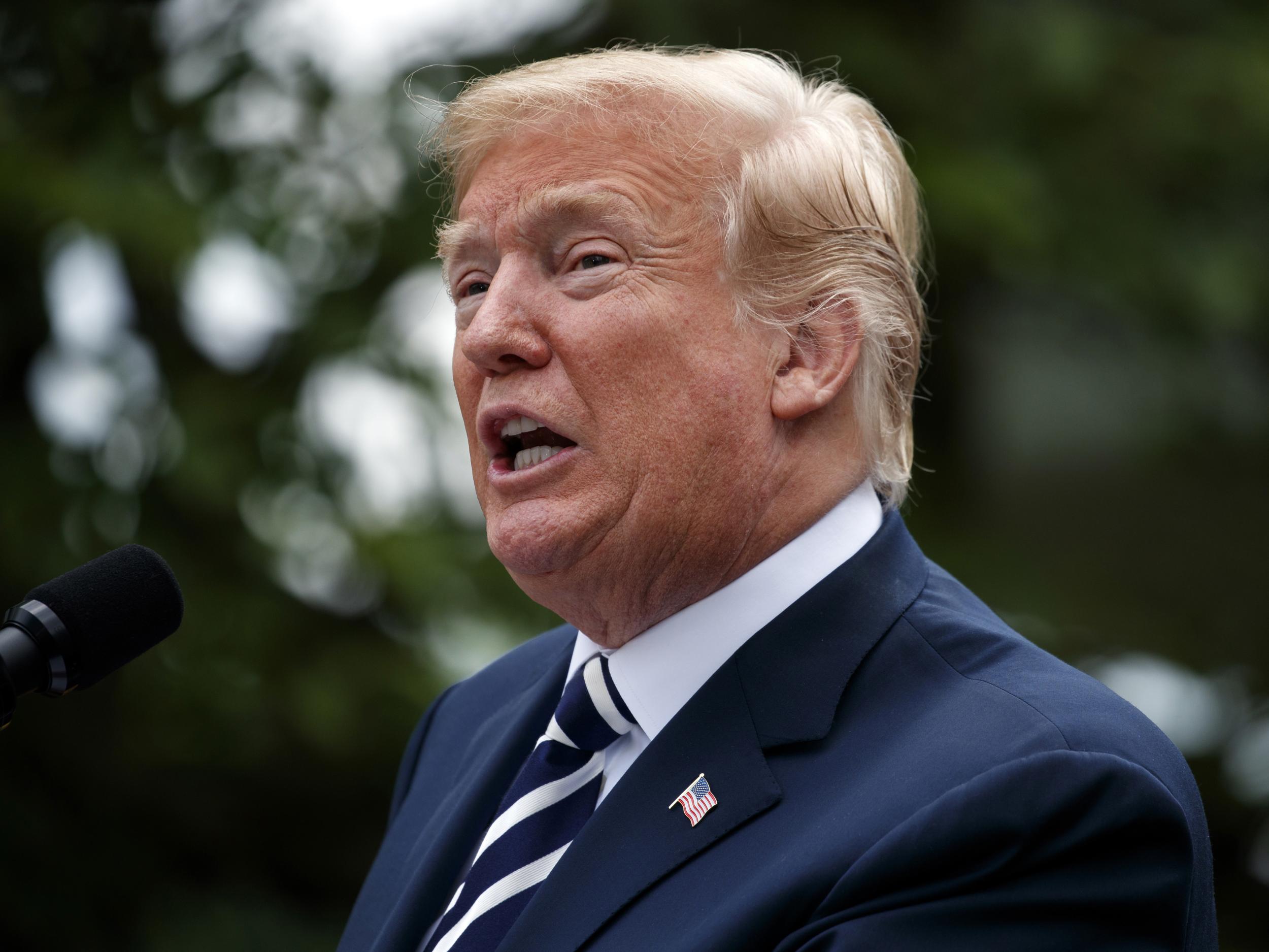 President Donald Trump speaks during a bill signing ceremony