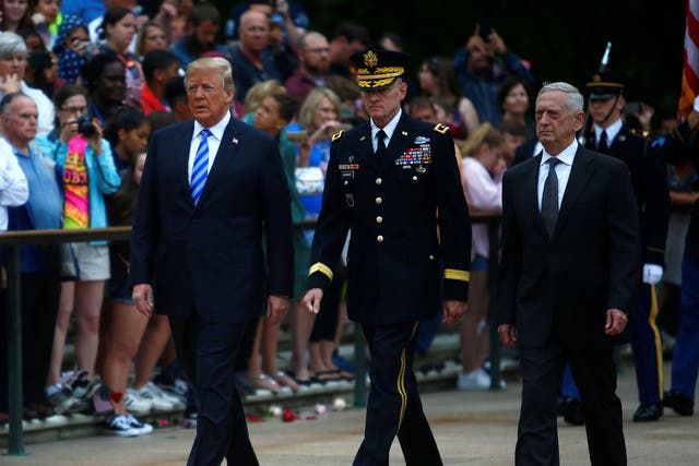 Donald Trump, General Joseph Dunford, chairman of the Joint Chiefs of Staff, and James Mattis, the defence secretary, attend a wreath laying ceremony at the Tomb of the Unknown Soldier at Arlington National Cemetery as part of Memorial Day observance, Arlington