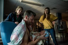 Unicef photographer captures men bonding with their newborns