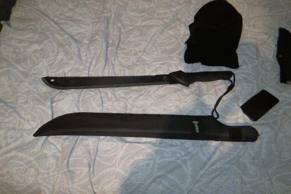 A machete found by police on Micah Bedeau's bed