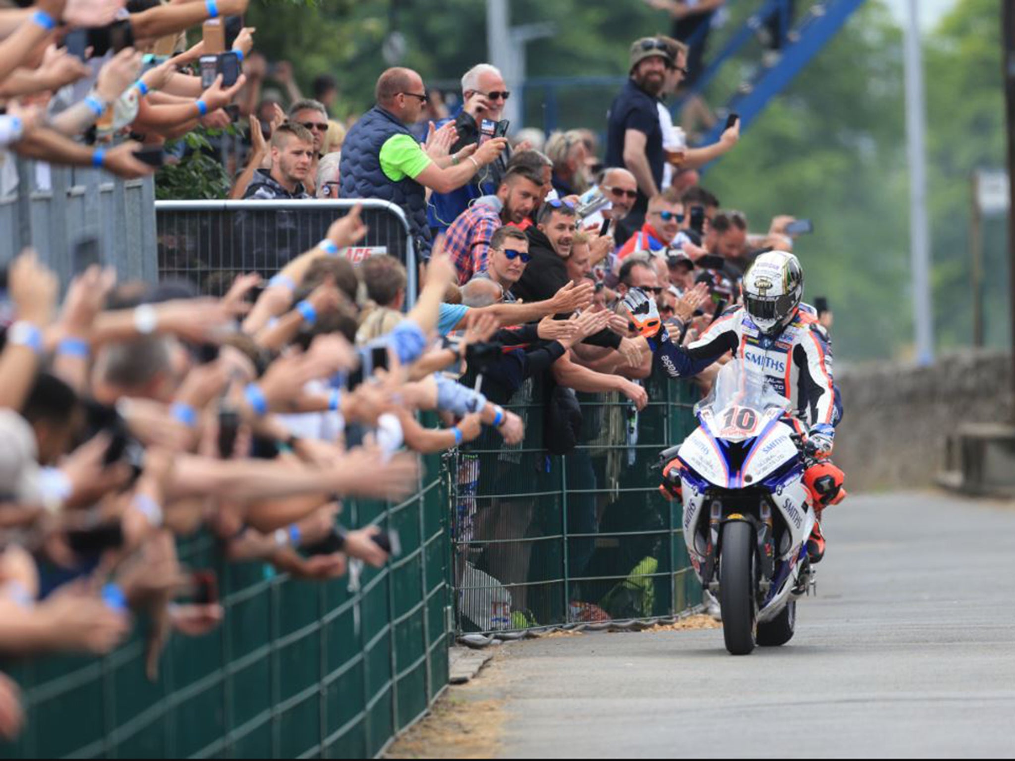 Peter Hickman celebrates with fans after winning the Senior TT