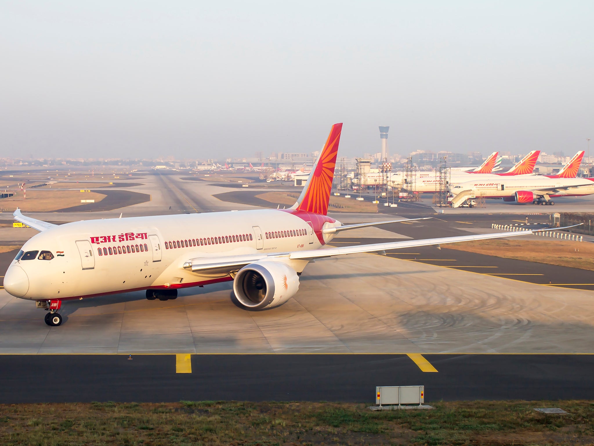 Air India 787 Dreamliner and fleet of Boeing 777, 747 in the back