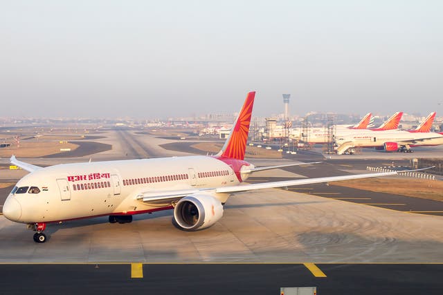 Air India 787 Dreamliner and fleet of Boeing 777, 747 in the back