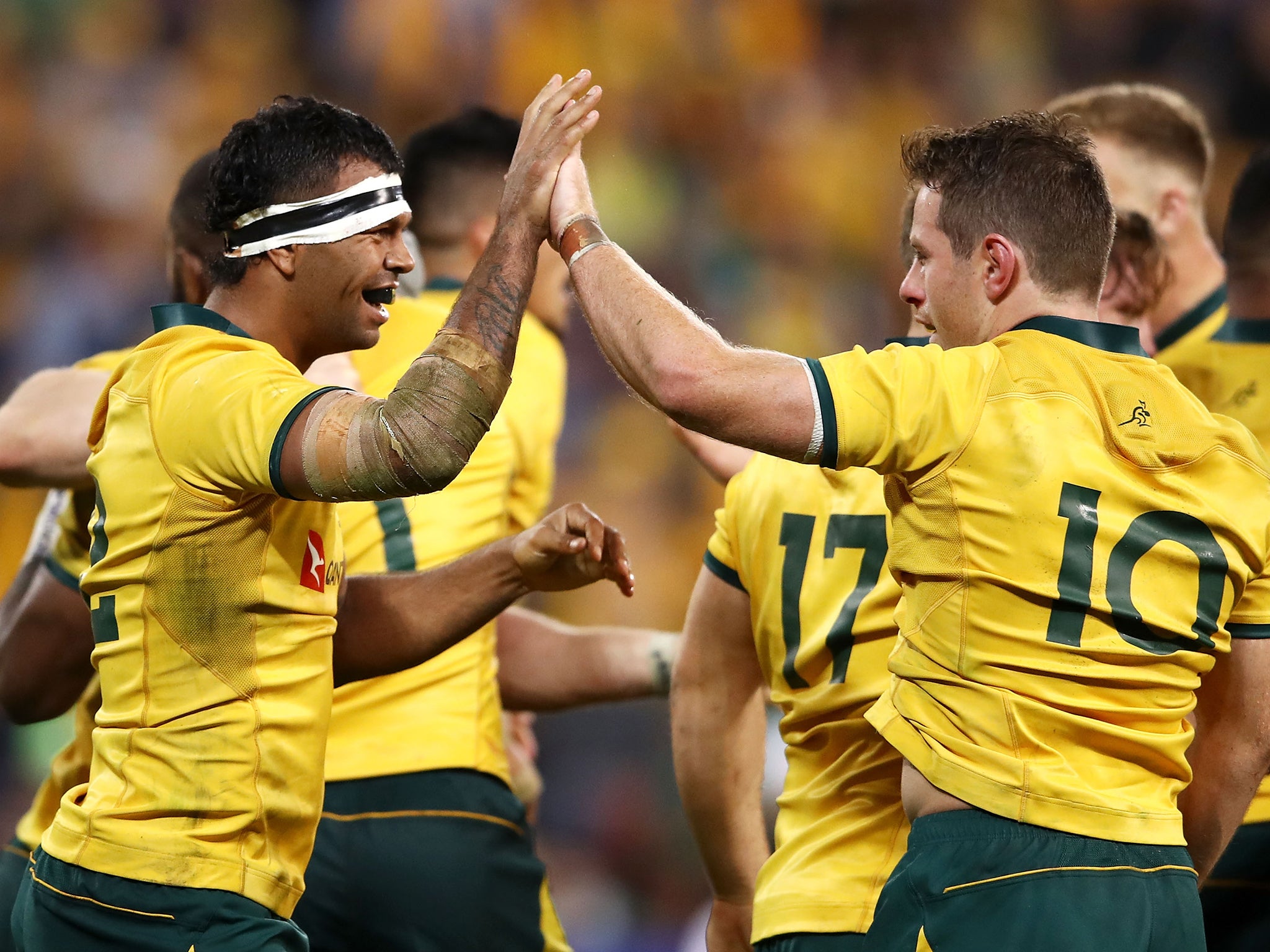 Australia celebrate their 18-9 victory over Ireland