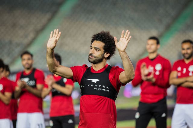 Mohamed Salah acknowledges the crowds in Cairo during an Egypt training session