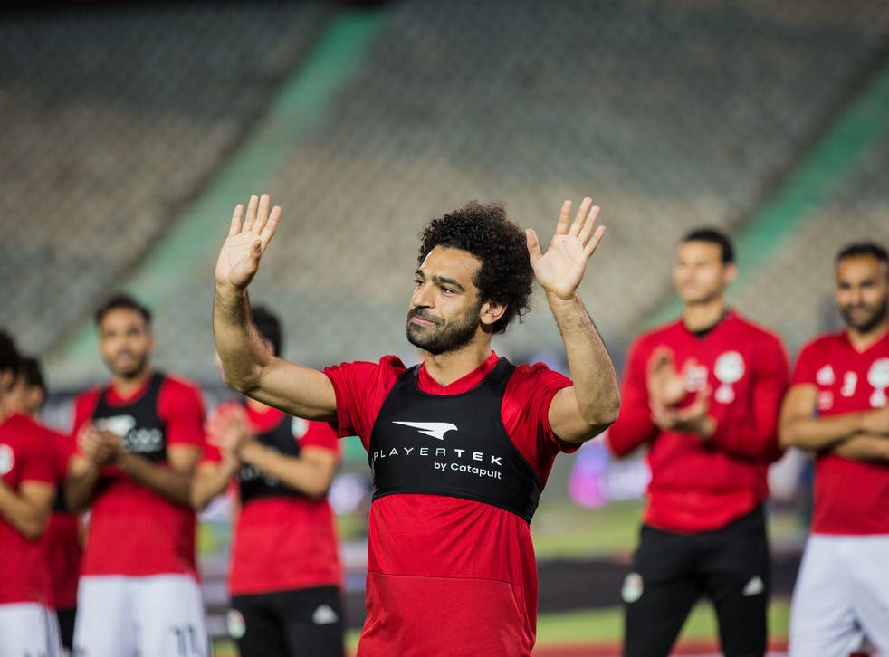 Mohamed Salah acknowledges the crowds in Cairo during an Egypt training session