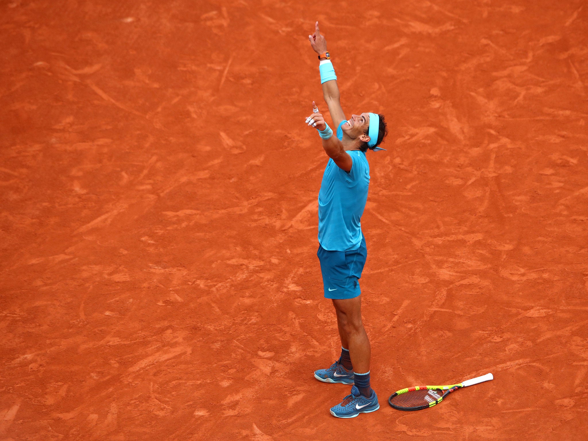 Rafael Nadal celebrates securing his 11th title at Roland Garros