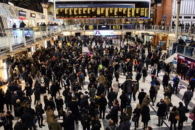 Commuters wait for trains at Liverpool Street station during travel disruption in 2017