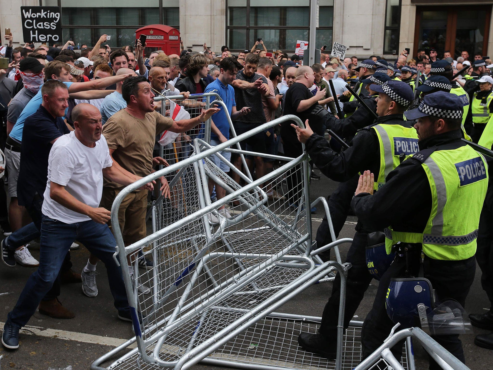 Protesters scuffle with police at the junction of Whitehall and The Mall during a 'Free Tommy Robinson' protest on 9 June