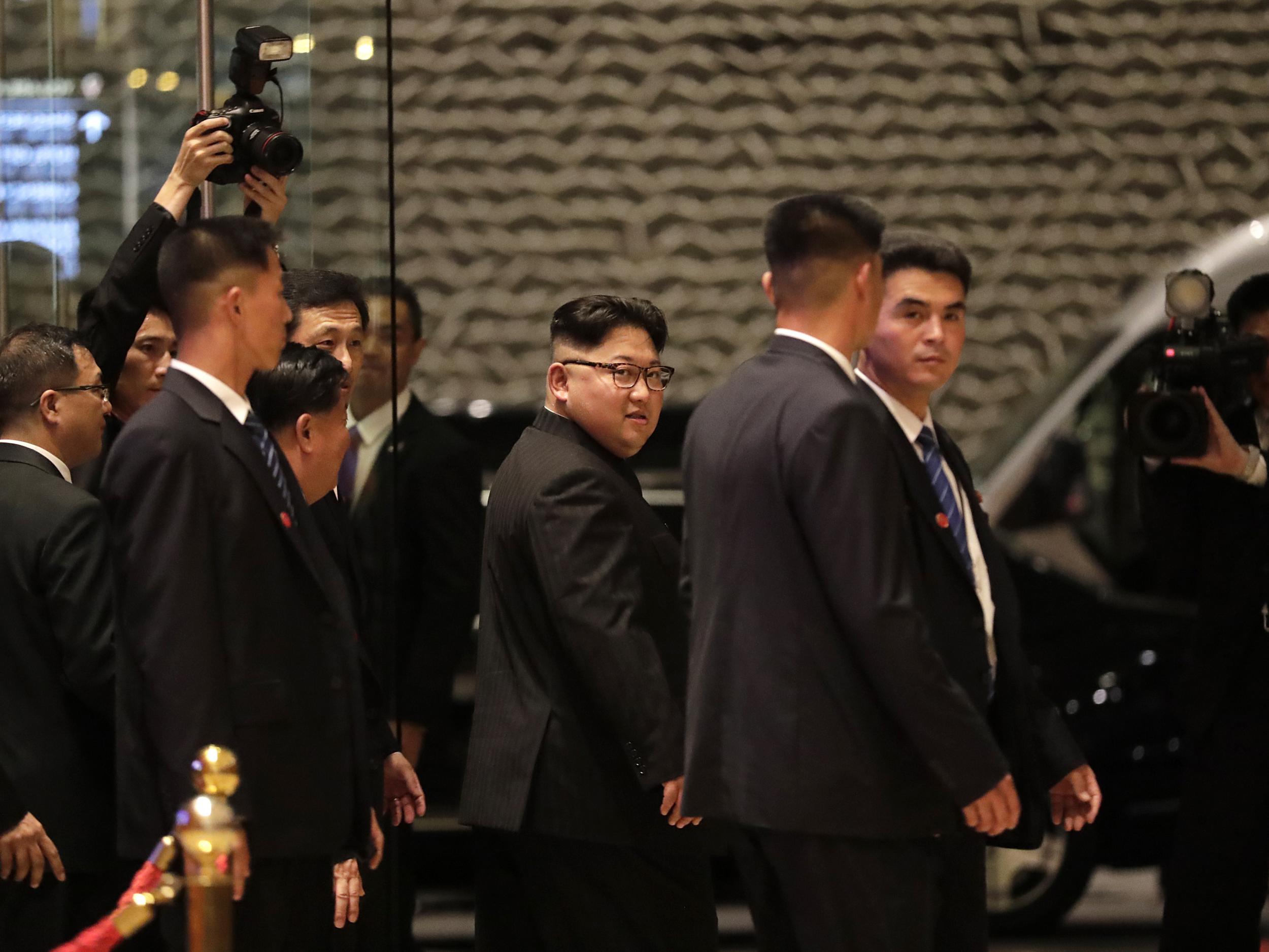 The North Korean leader flanked by his bodyguards