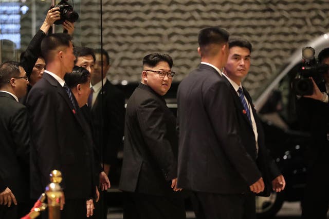 The North Korean leader flanked by his bodyguards