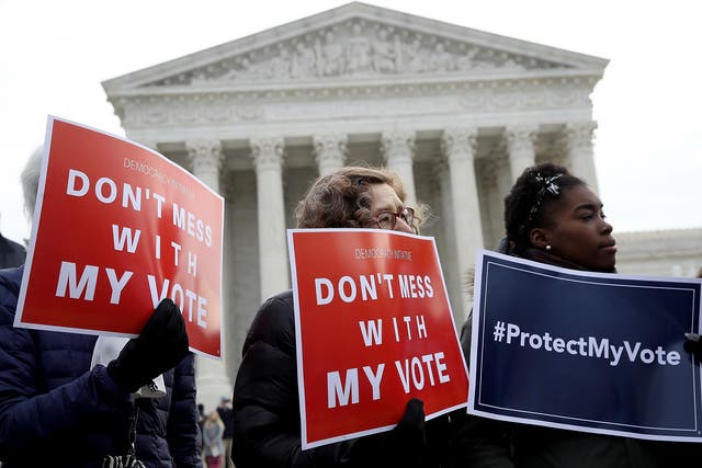 Protesters gather during a rally held by the group Common Cause in front of the US Supreme Court