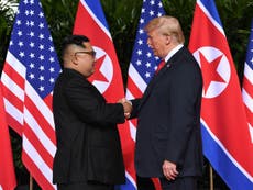 Donald Trump and Kim Jong-un shake hands in historic moment