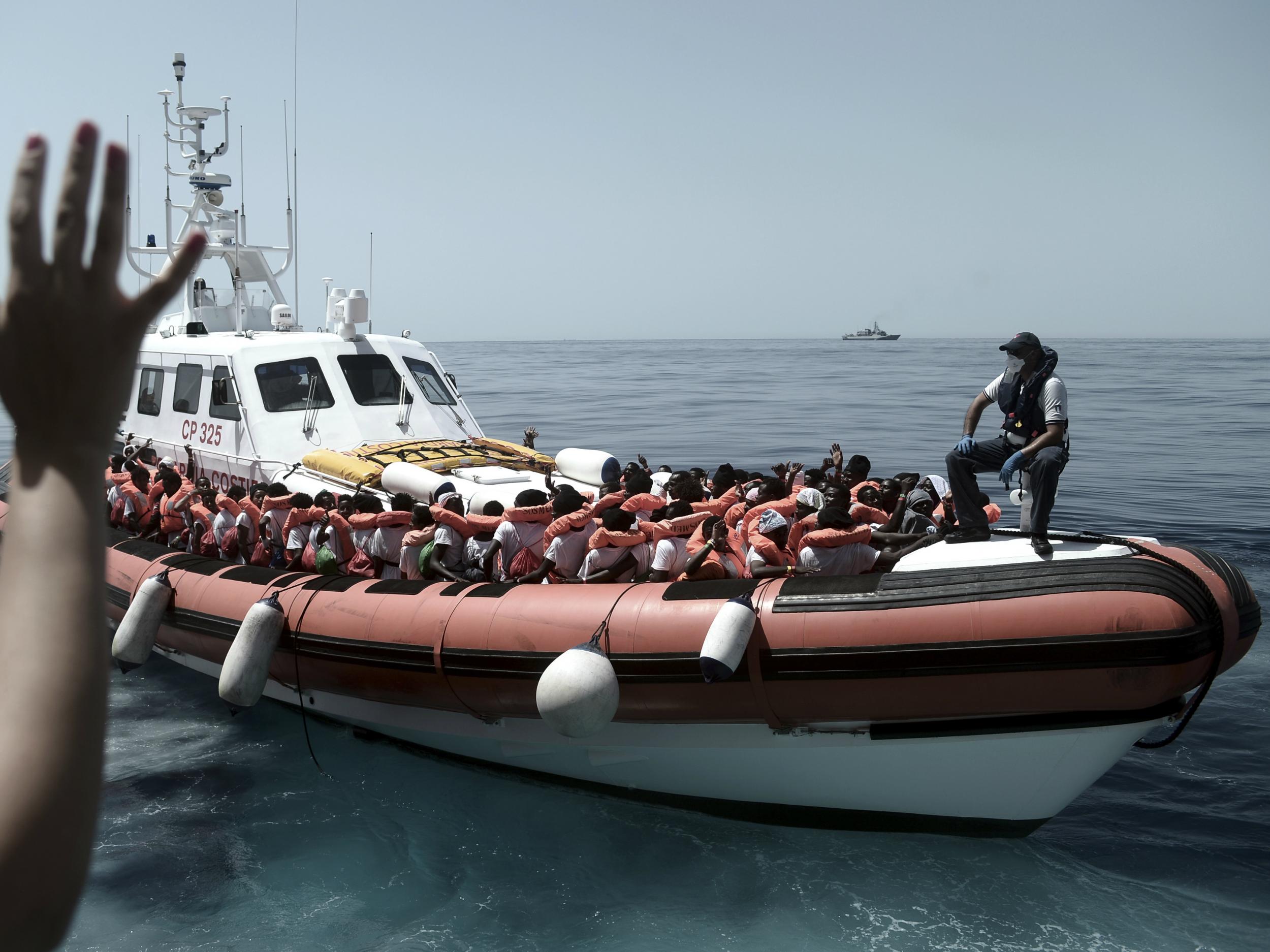 Stranded migrants were transferred from the Aquarius to Italian ships (AP/SOS Mediterranee)
