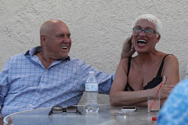 Dennis Hof, left, jokes with madam Sonja Bandolik in at the Love Ranch brothel in Crystal, Nevada, in April