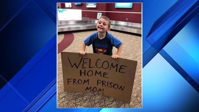 The woman's son greeting her in the arrivals lounge