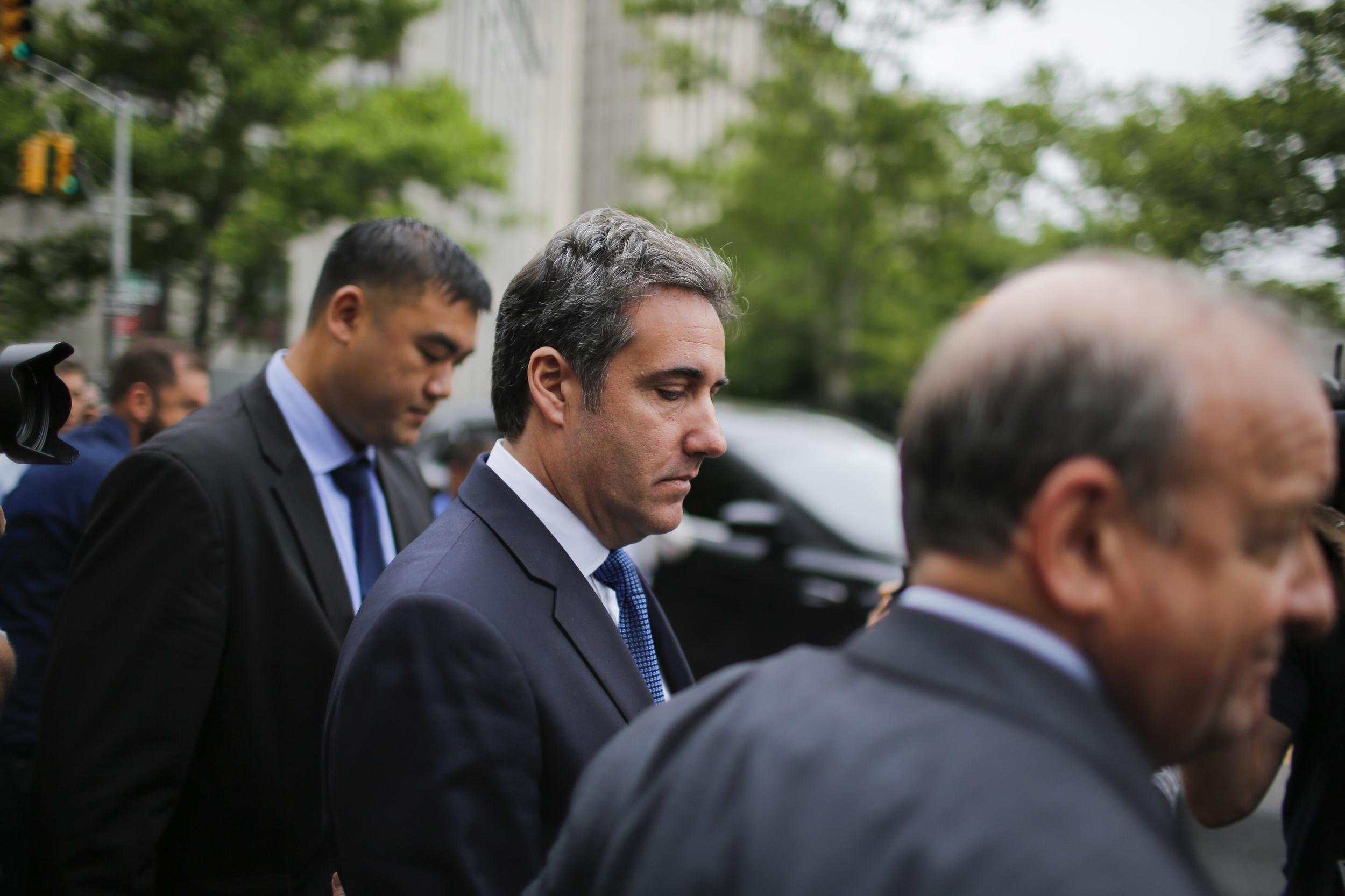 Michael Cohen, (C) former personal lawyer and confidante for President Donald Trump, exits the United States District Court Southern District of New York