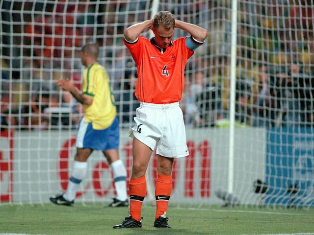 Holland's captain Frank De Boer dejected after his team were knocked out of the World Cup in a penalty shoot-out