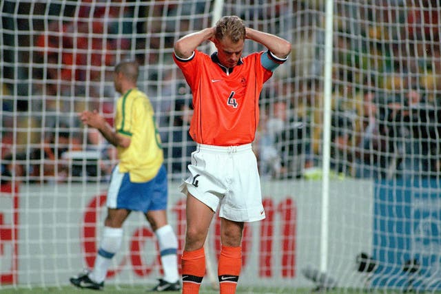 Holland's captain Frank De Boer dejected after his team were knocked out of the World Cup in a penalty shoot-out