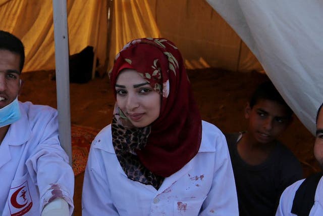 Najjar was often photographed on the front line with the blood of her patients spattered on her white medic’s uniform
