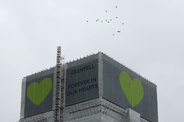 Green balloons are released over Grenfell Tower on the one year anniversary of the Grenfell Tower fire on June 14, 2018 in London, England. In one of Britain's worst urban tragedies since World War II, a devastating fire broke out in the 24-storey Grenfell Tower on June 14, 2017 where 72 people died from the blaze in the public housing building of North Kensington area of London. 