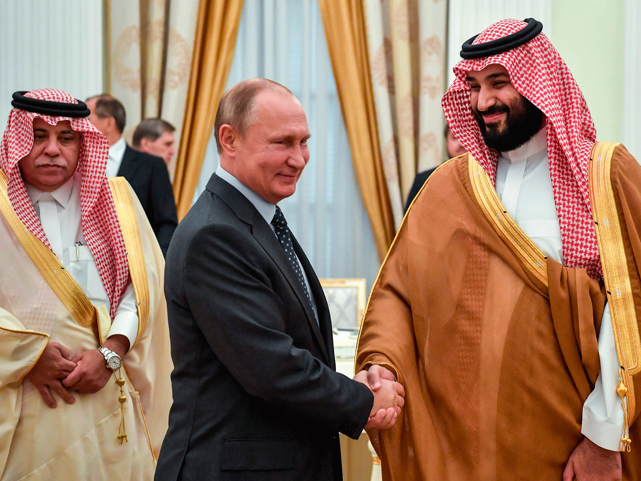 Russian president Vladimir Putin shakes hands with Saudi Crown Prince Mohammed bin Salman at the Kremlin on Thursday
