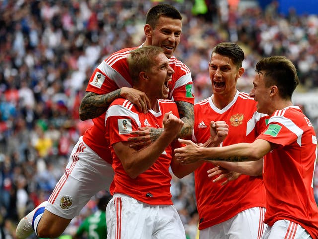 Yuri Gazinskiy celebrates scoring Russia’s opening goal