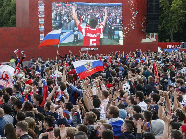 Russia fans watch on a giant screen in Moscow