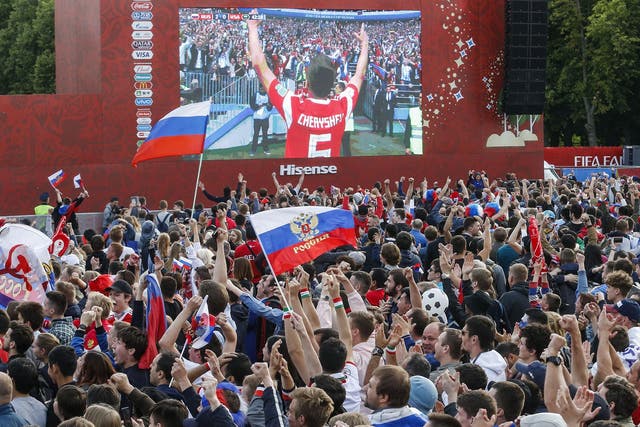 Russia fans watch on a giant screen in Moscow
