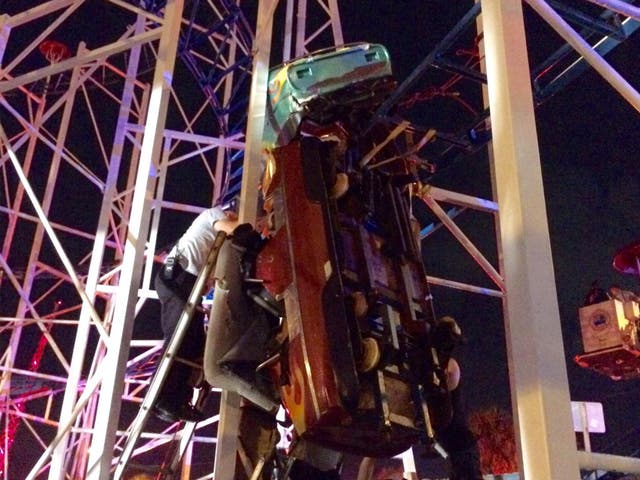 One of the three cars was left dangling vertically from the track