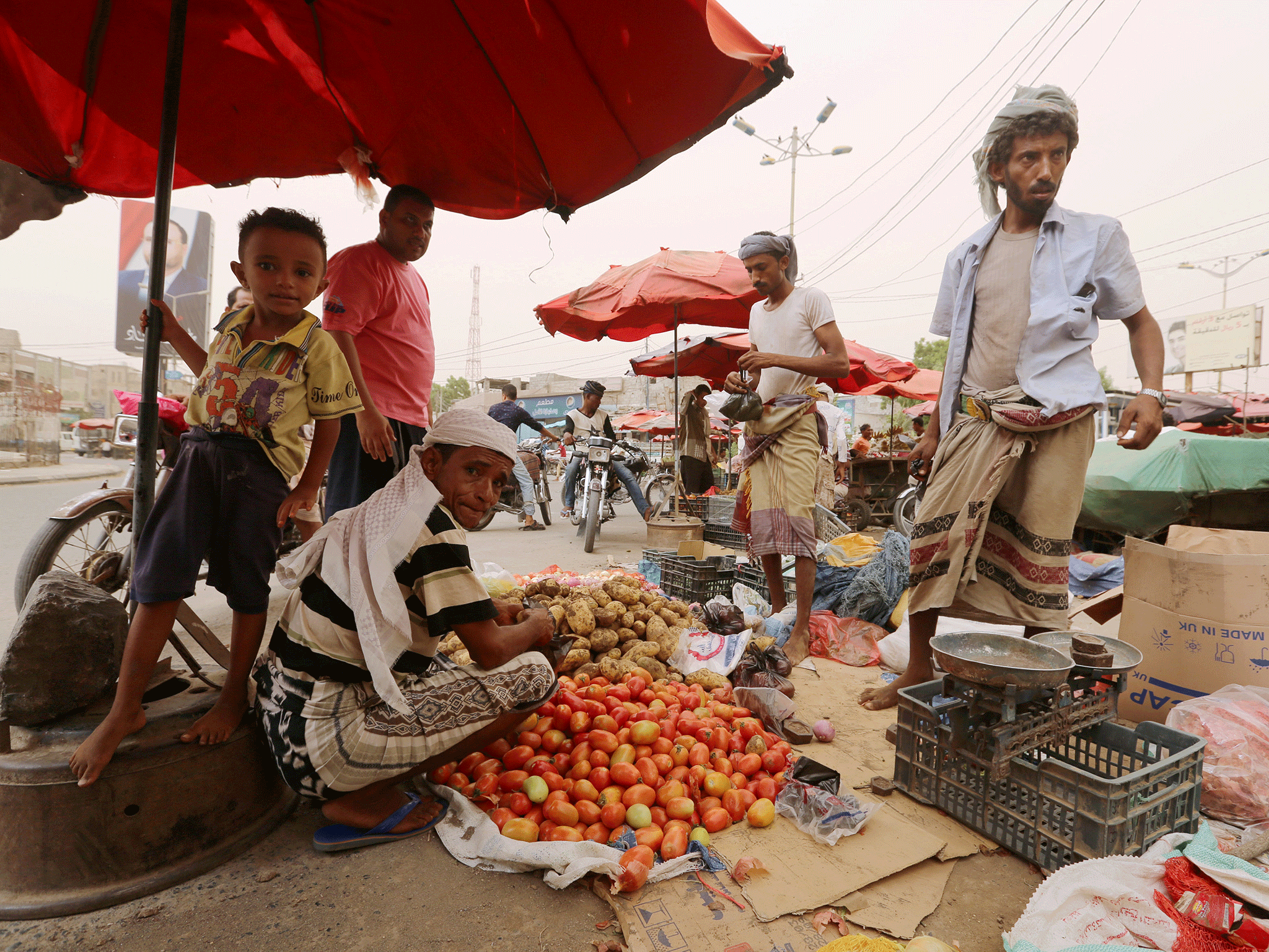 A street vendor sells vegetables in the Red Sea port city of Hodeidah, Yemen, 14 June