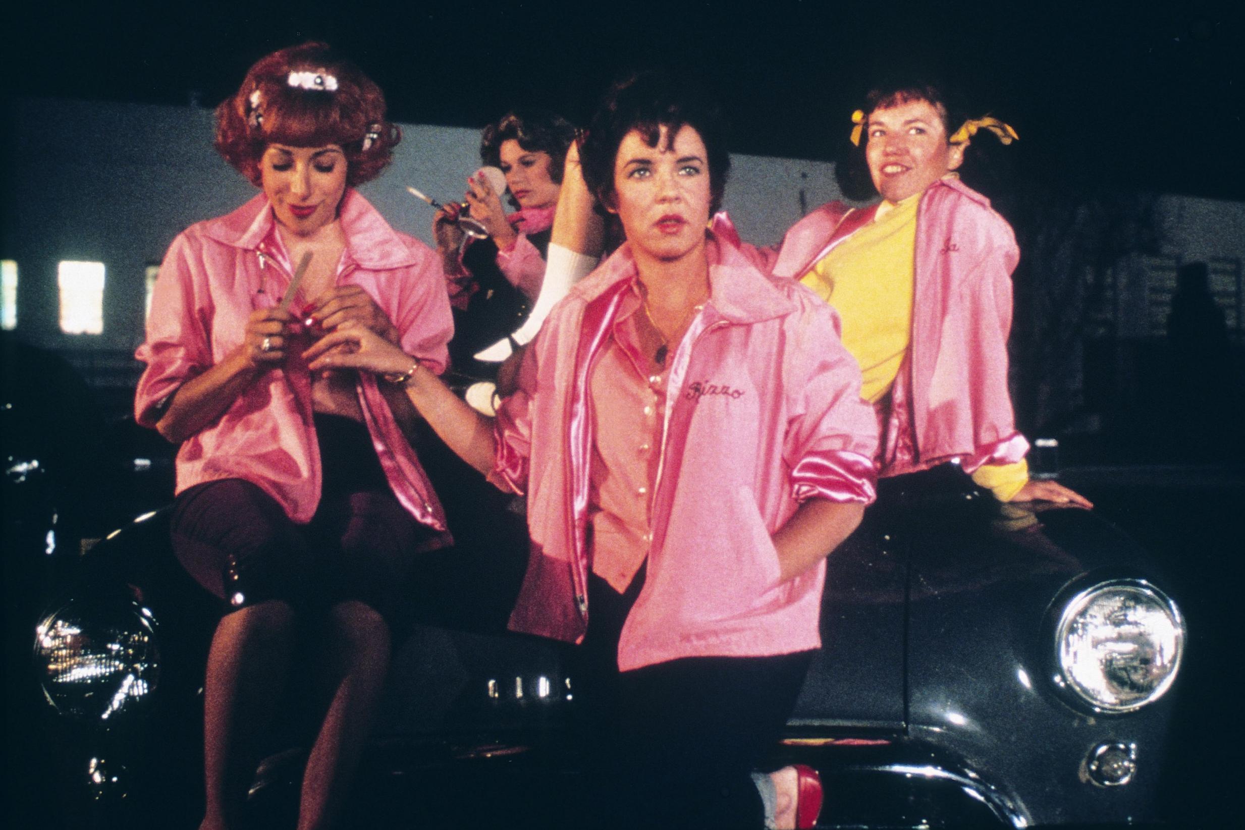 The outfits in the film are iconic, especially the Pink Ladies jackets