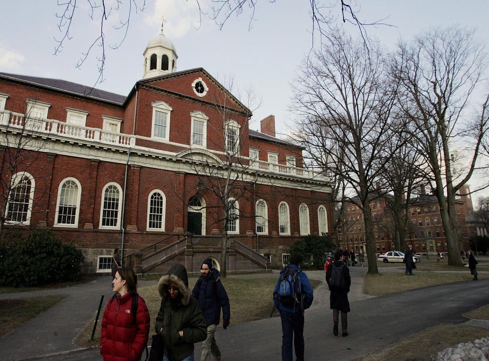 Harvard University students walk through the campus