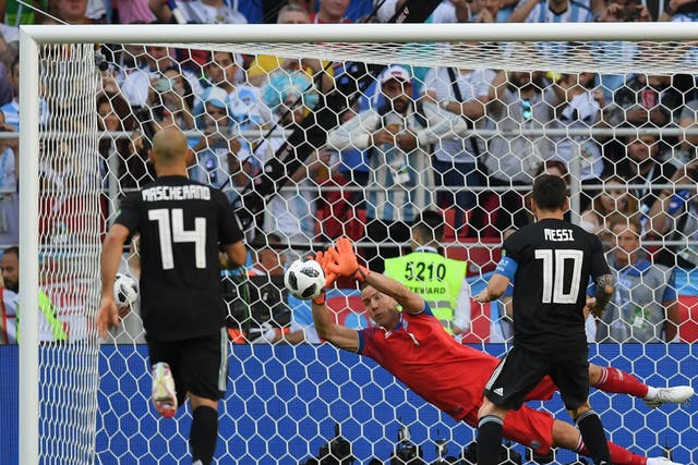 Hannes Halldorsson of Iceland saves a penalty from Lionel Messi of Argentina