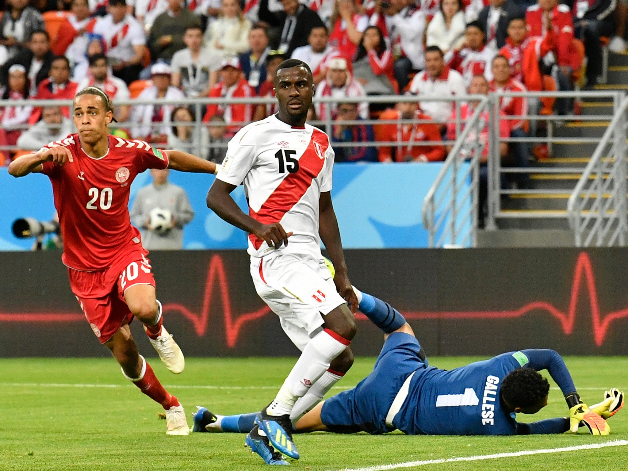 Poulsen, left, celebrates after scoring