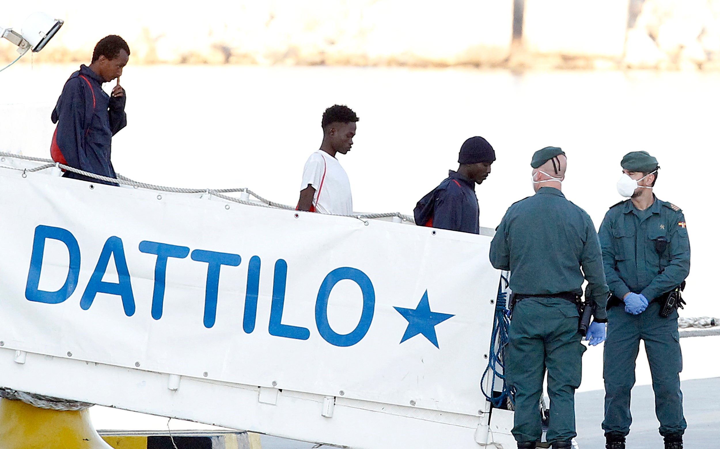 Doctors and interpreters assisted the migrants leaving the ship