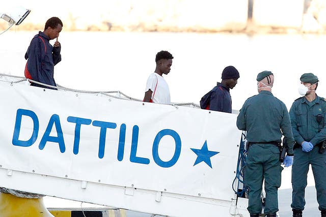 Doctors and interpreters assisted the migrants leaving the ship