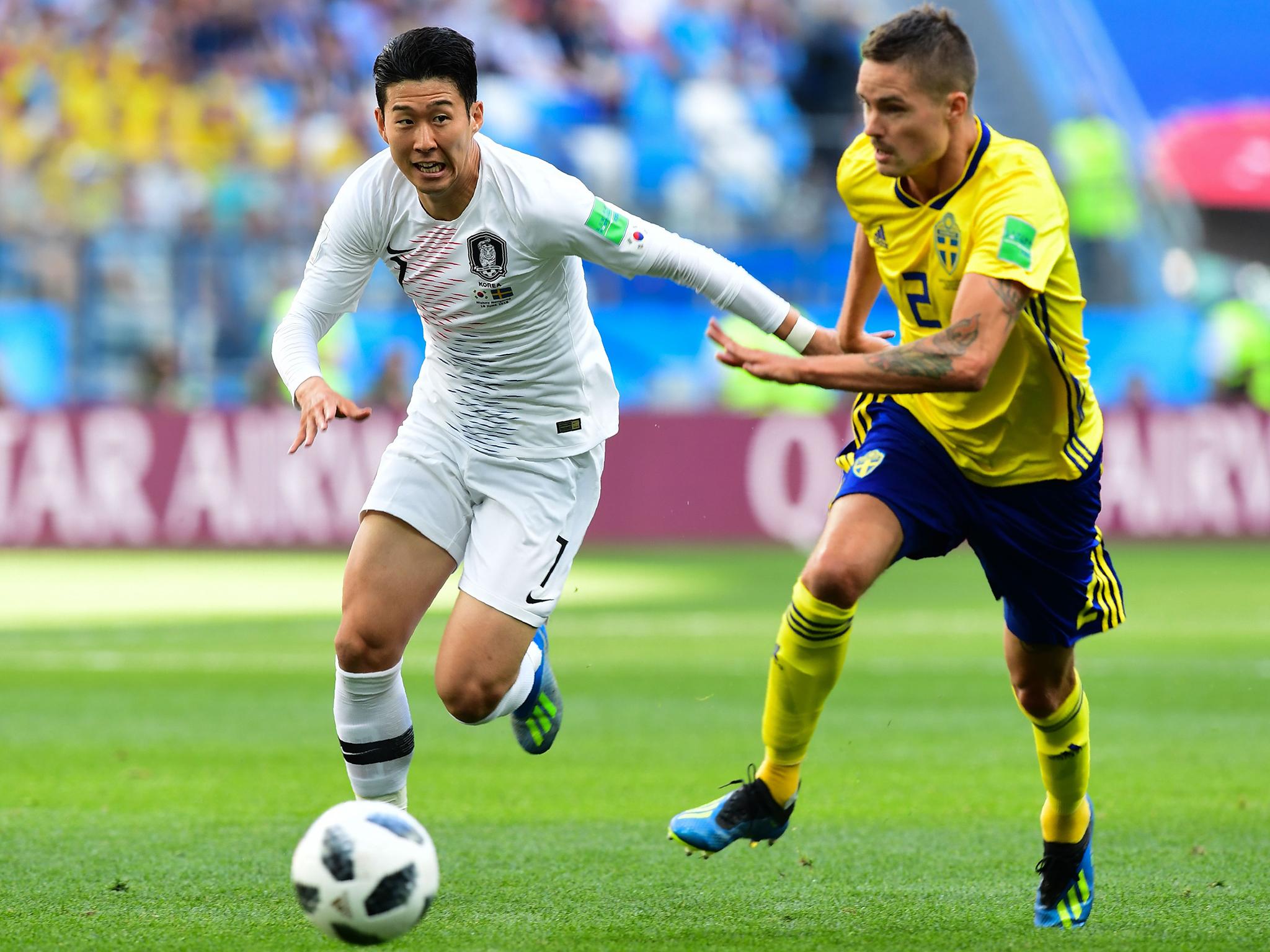 Son Heung-min fends off Mikael Lustig during South Korea's encounter with Sweden