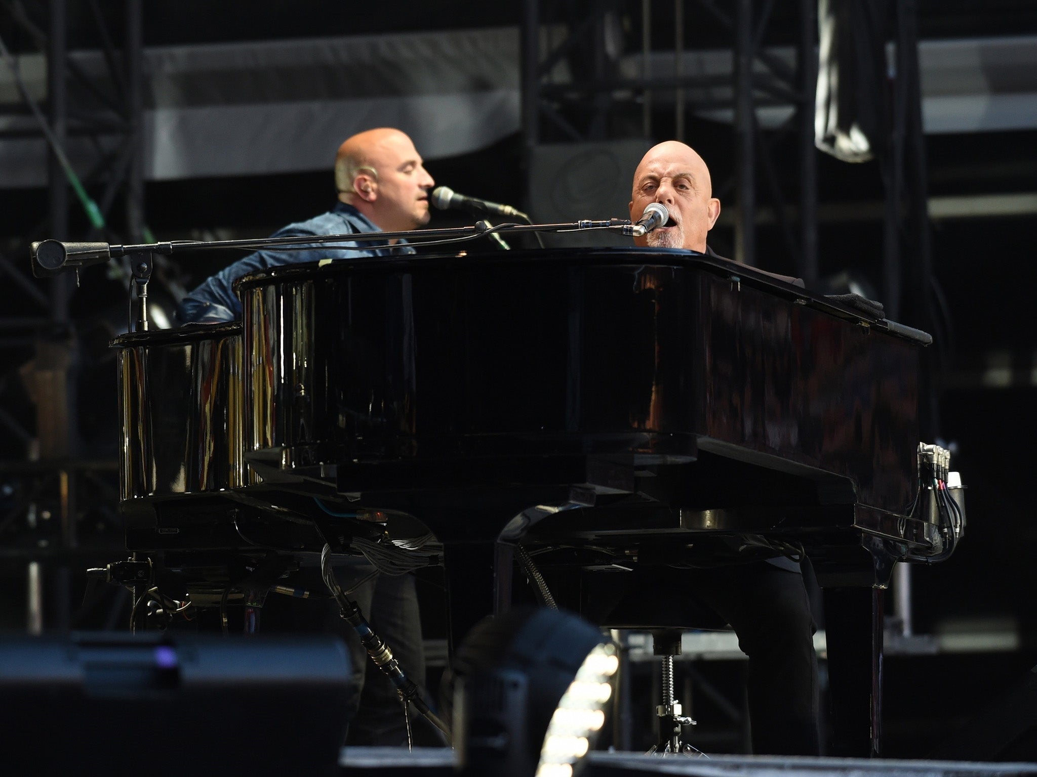 Billy Joel performing to a sell out crowd at Old Trafford Football Ground in Manchester