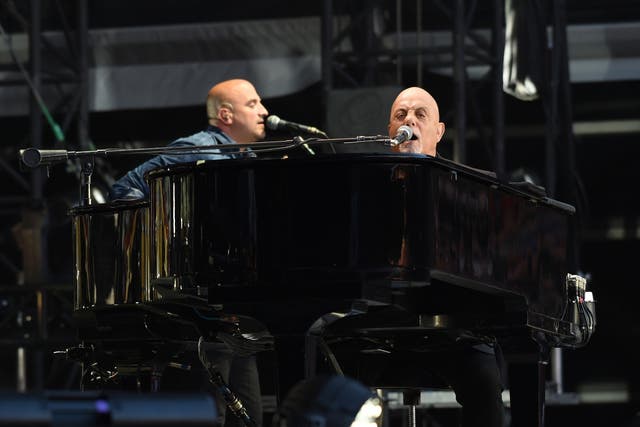 Billy Joel performing to a sell out crowd at Old Trafford Football Ground in Manchester